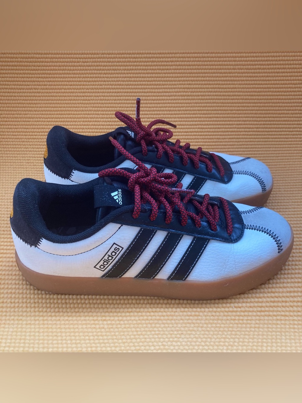 Adidas  White Leather Trainer with Black Stripes and Gum Sole